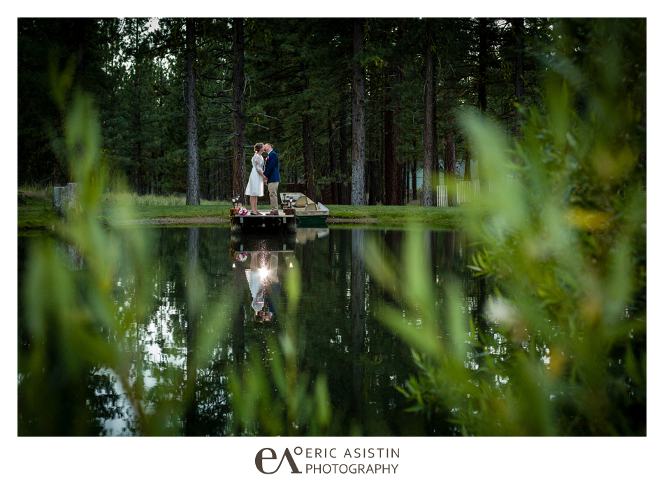 Bride & Groom on the dock at the private pond at The Chalet View Lodge. Portola CA