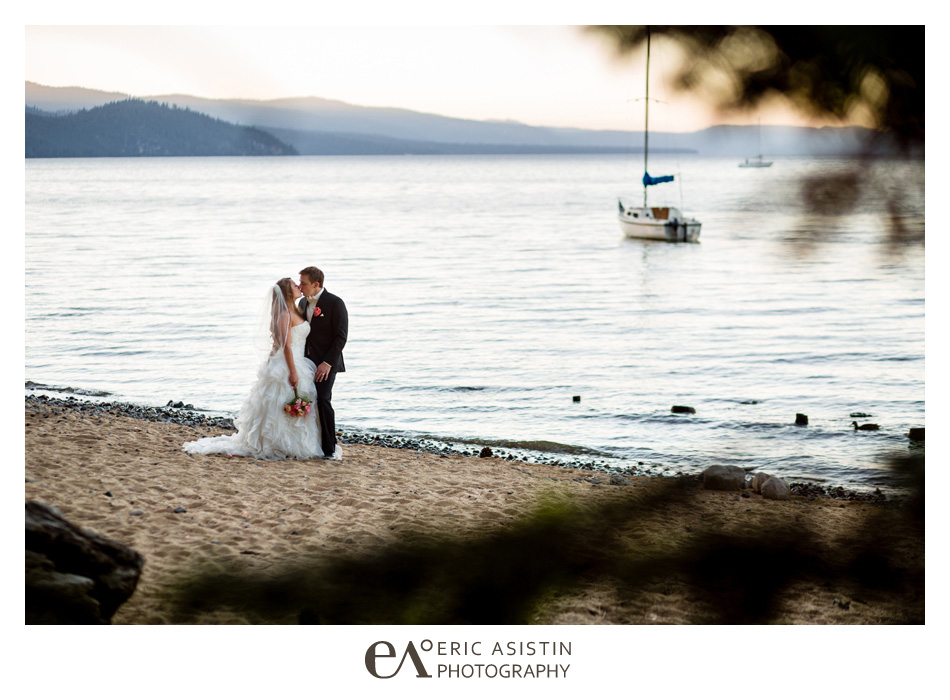 Bride and Groom kiss along the beach at the Historic Valhalla Estate South Lake Tahoe Wedding